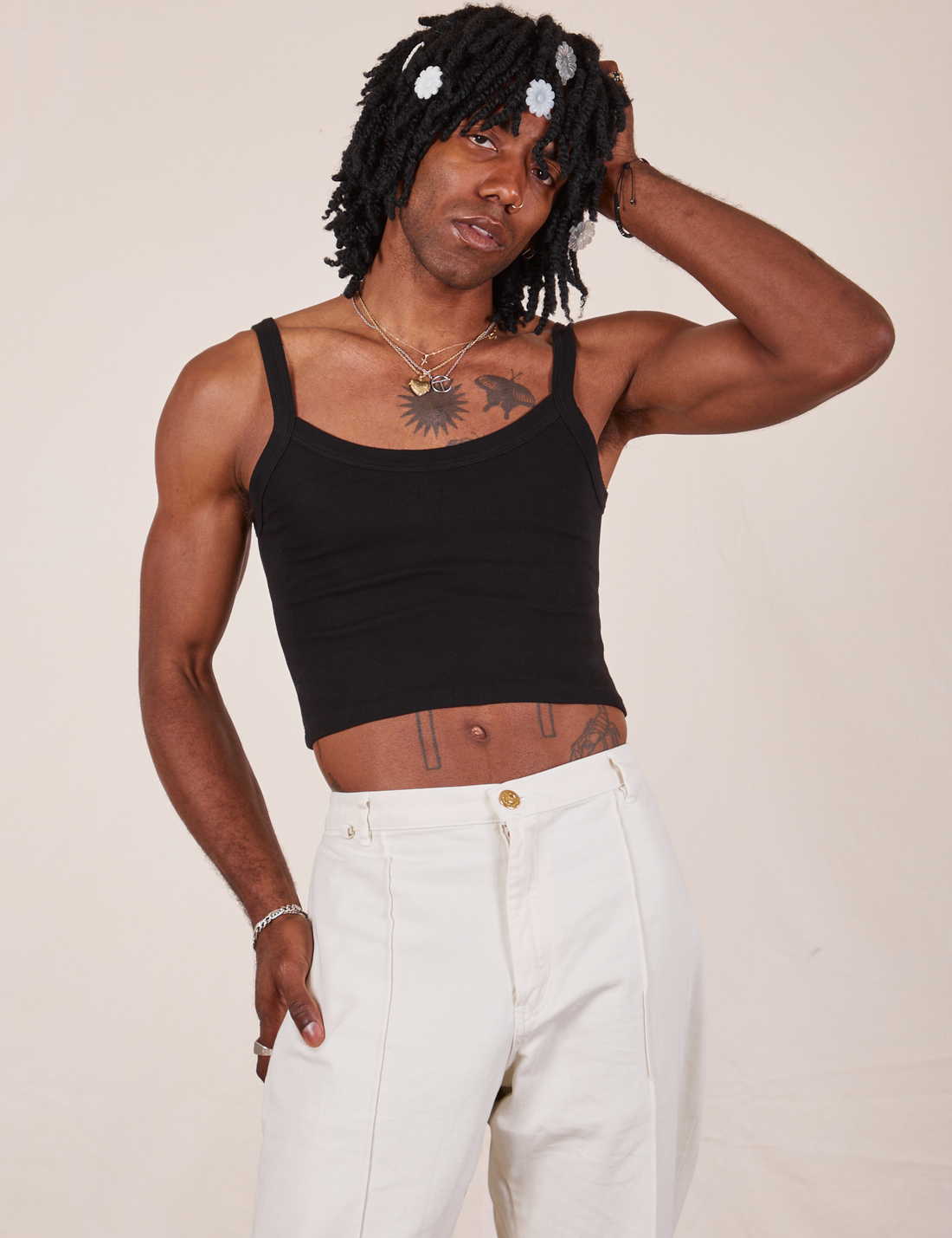 Jerrod is wearing Cropped Cami in Basic Black and vintage off-white Western Pants