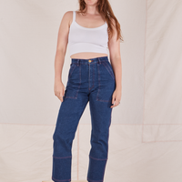 Allison is 5'10" and wearing S Carpenter Jeans in Dark Wash paired with vintage off-white Cami