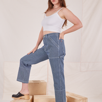 Side view of Carpenter Jeans in Railroad Stripes worn by Allison