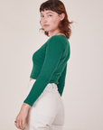 Side view of Long Sleeve V-Neck Tee in Hunter Green on Alex