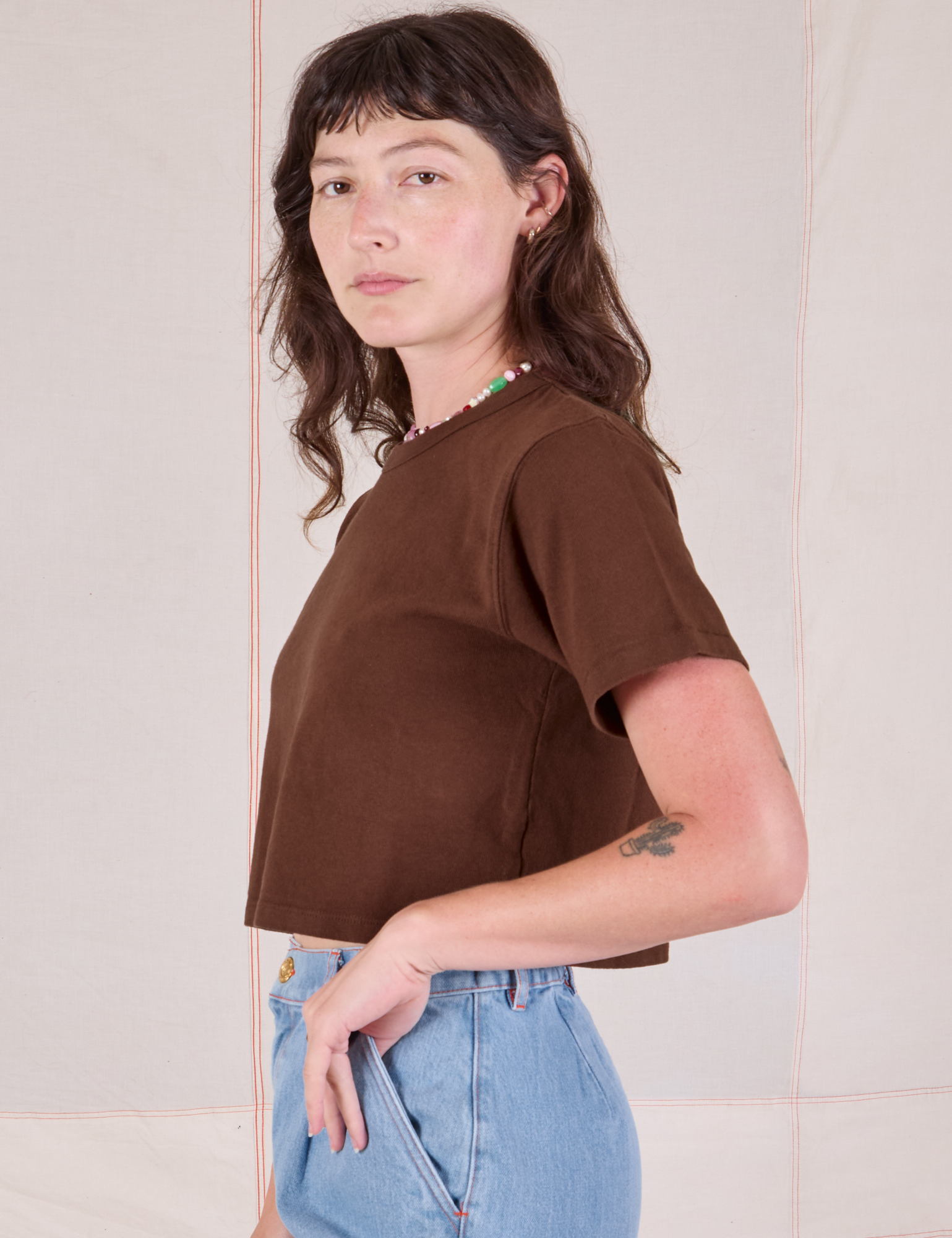 Cropped Burly Tee in Fudgesicle Brown side view on Alex