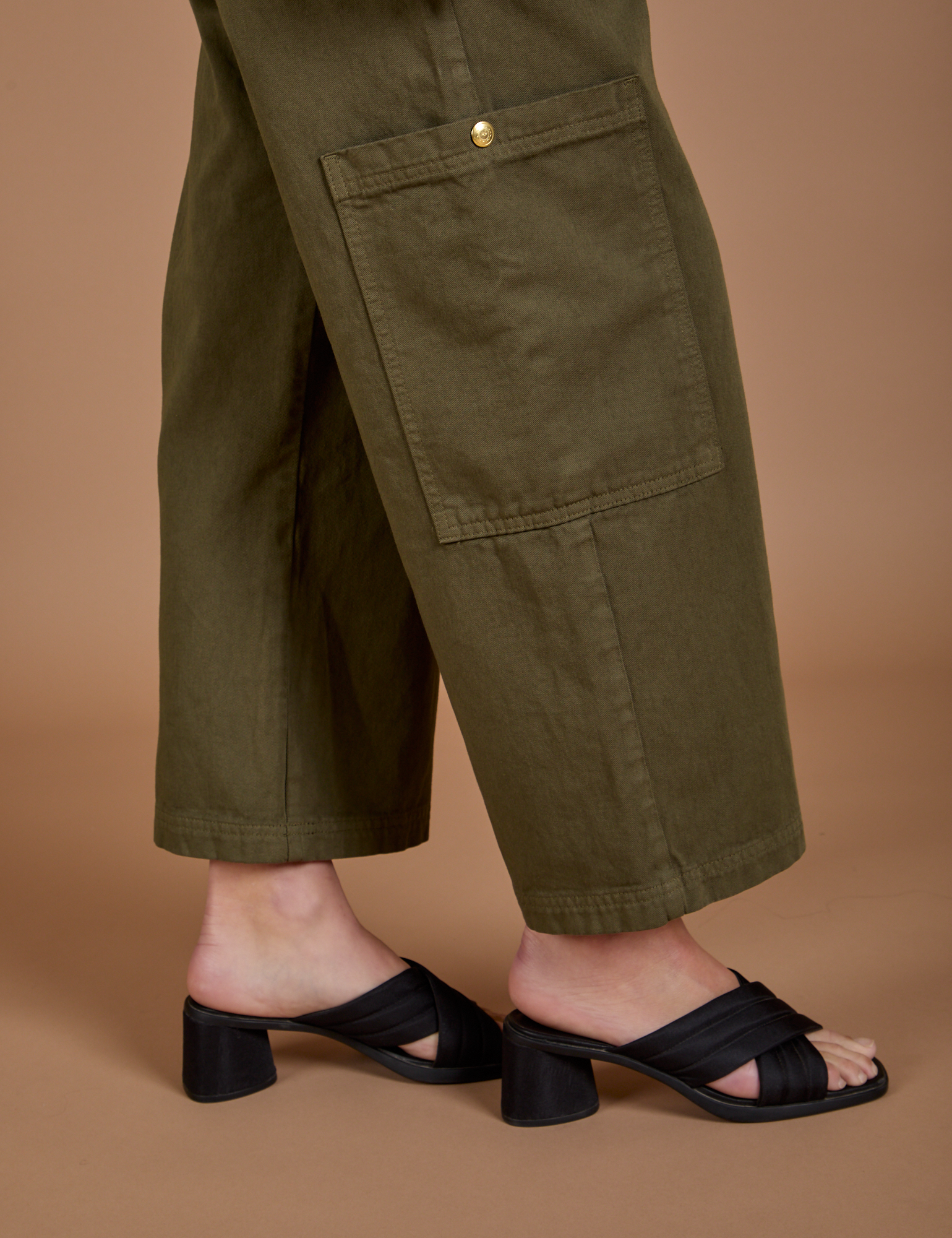 Drop Pocket Cargo Pants in Surplus Green pant leg close up on Alex