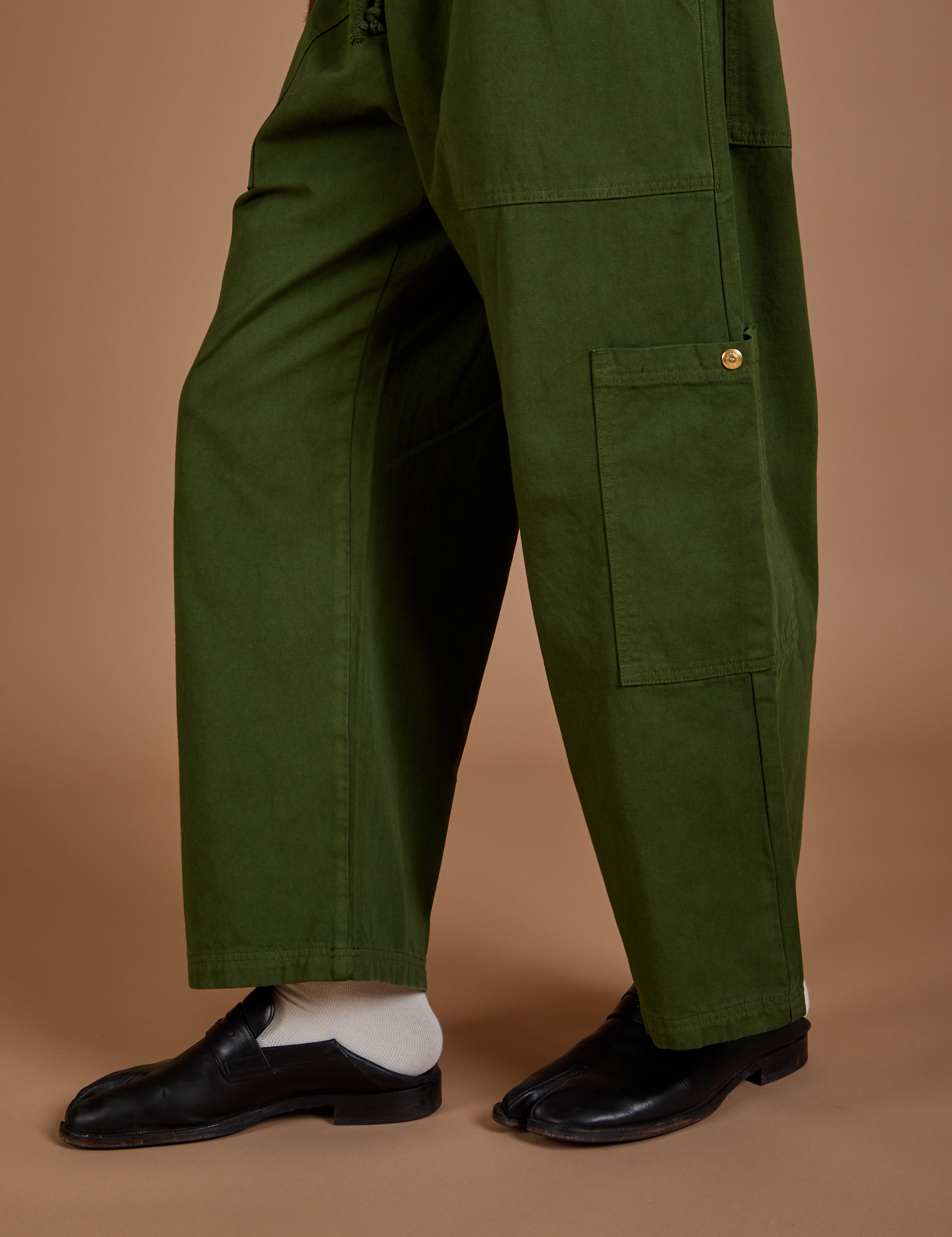 Drop Pocket Cargo Pants in Evergreen pant leg close up on Jerrod