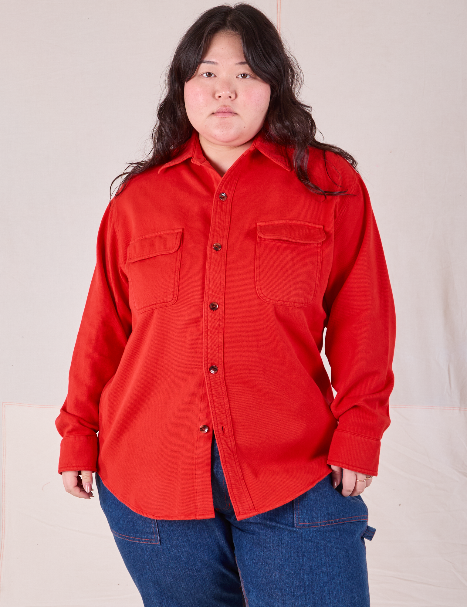 Ashley is wearing a buttoned up Flannel Overshirt in Mustang Red