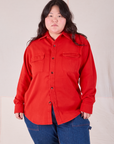 Ashley is wearing a buttoned up Flannel Overshirt in Mustang Red