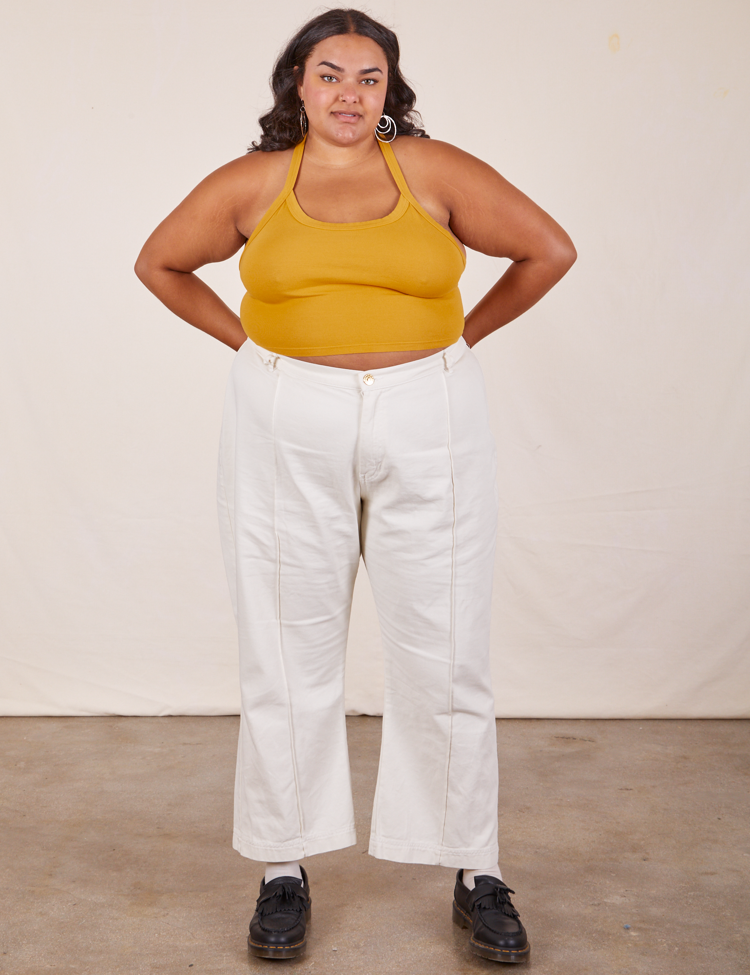Alicia wearing Halter Top in Mustard Yellow and vintage off-white Western Pants