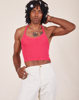 Jerrod is 6'3" and wearing XS Halter Top in Hot Pink paired with vintage off-white Western Pants