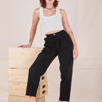 Alex is wearing Heavyweight Trousers in Basic Black and vintage off-white Cropped Tank Top.