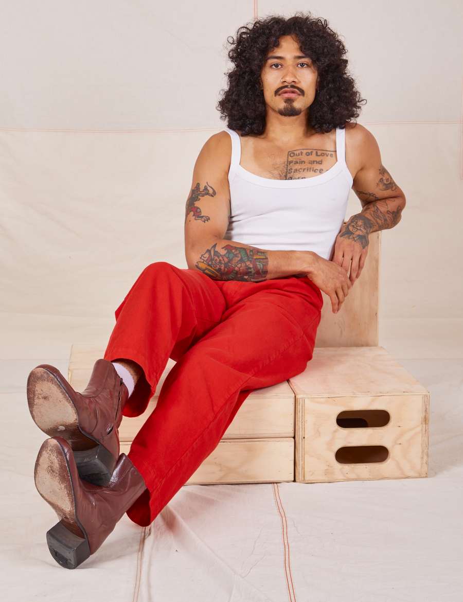 Jesse is wearing Heavyweight Trousers in Mustang Red and vintage off-white Cropped Cami