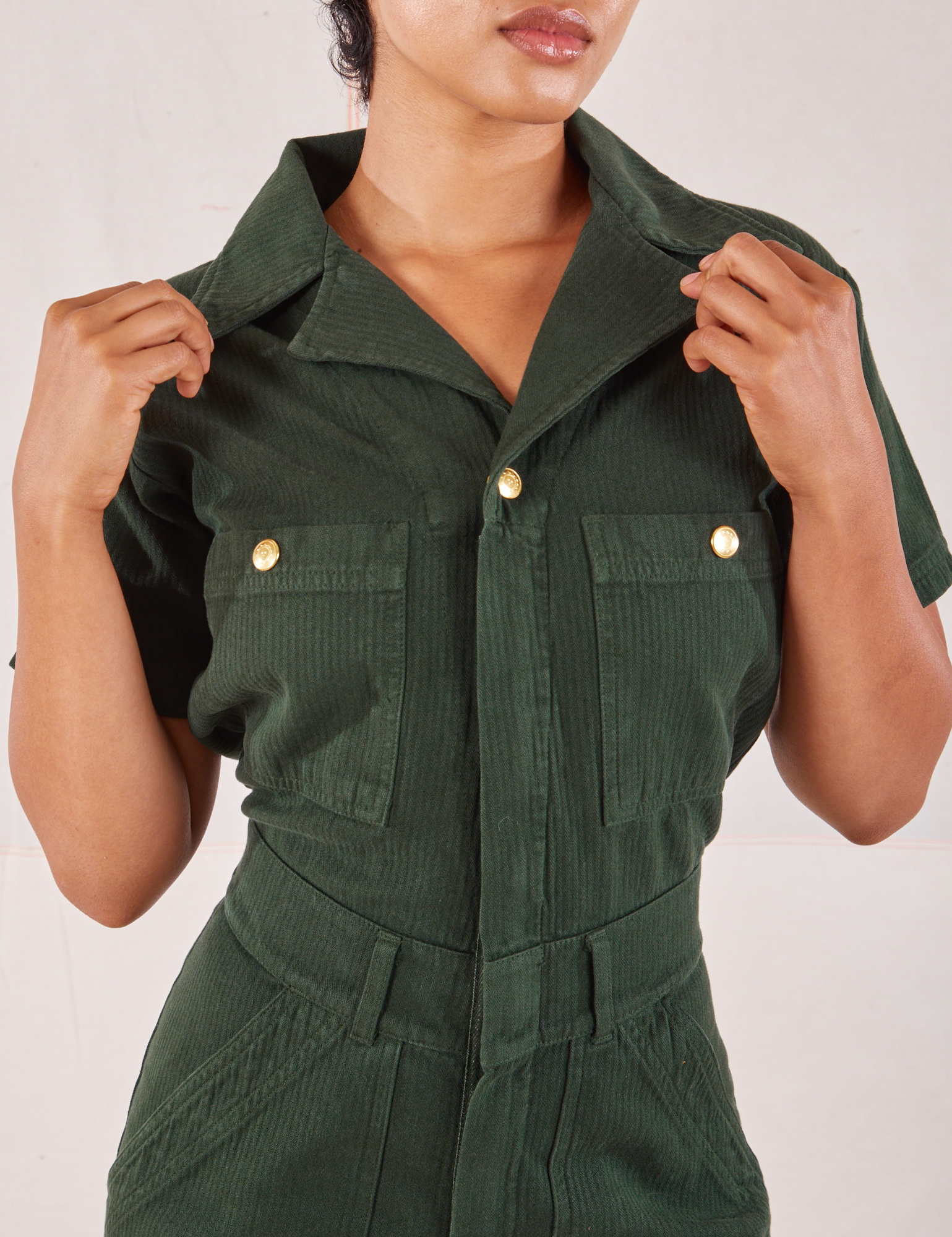 Heritage Short Sleeve Jumpsuit in Swamp Green front close up on Mika