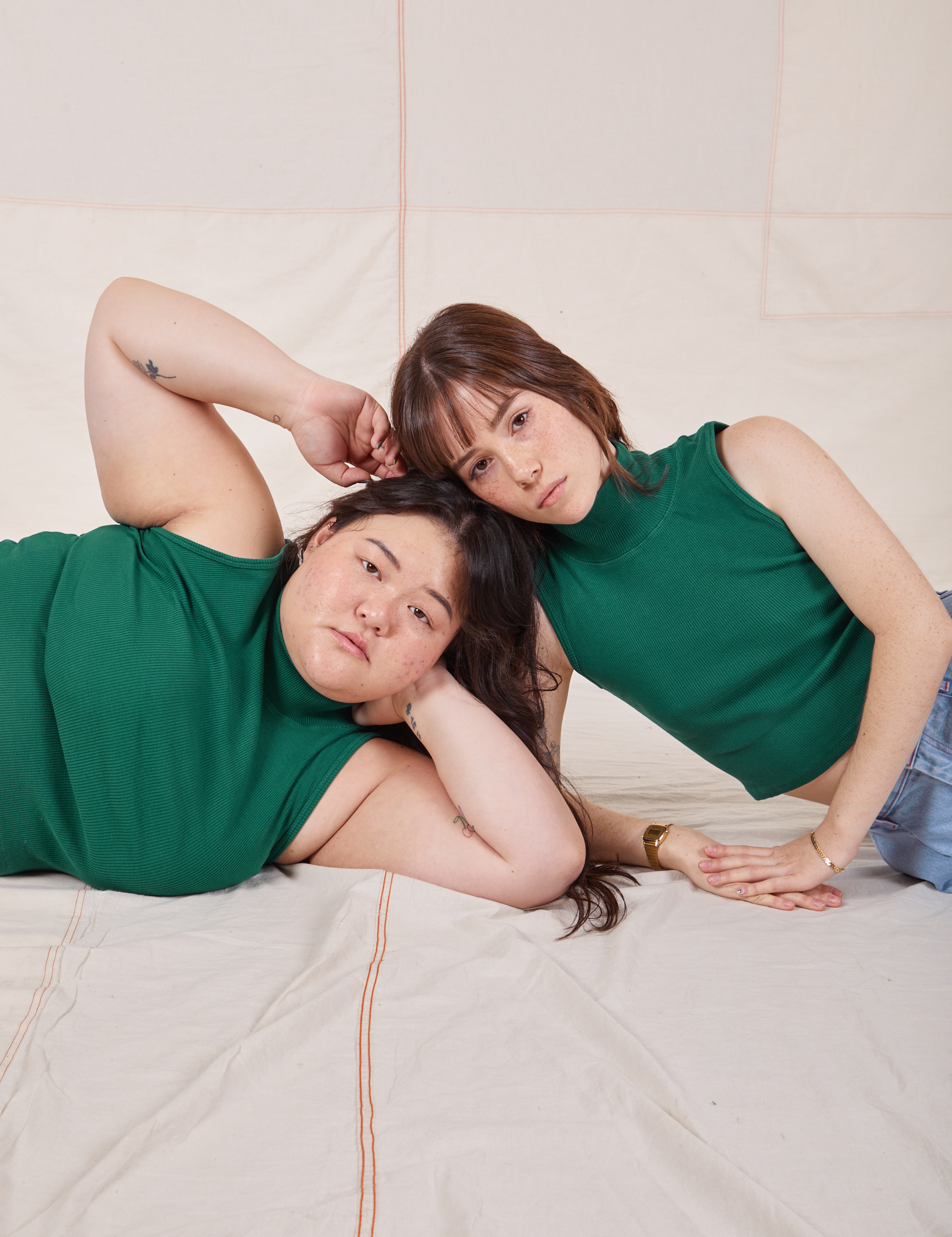 Ashley and Hana are both wearing Sleeveless Essential Turtleneck in Hunter Green
