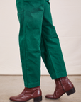 Side pant leg close up of Original Overalls in Mono Hunter Green worn by Jesse