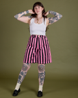 Sydney is 5’9” and wearing S Longline Work Shorts in Bubblegum Pink paired with vintage tee white Cropped Tank