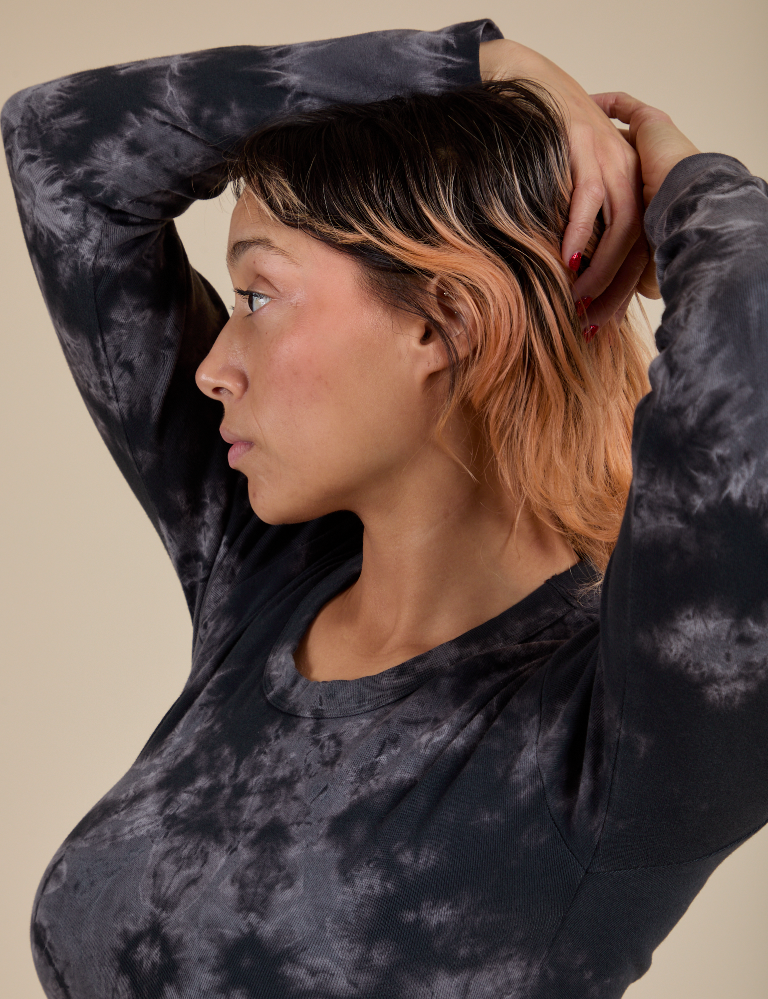 Long Sleeve Baby Tee in Black Magic Waters angled front view on Tiara