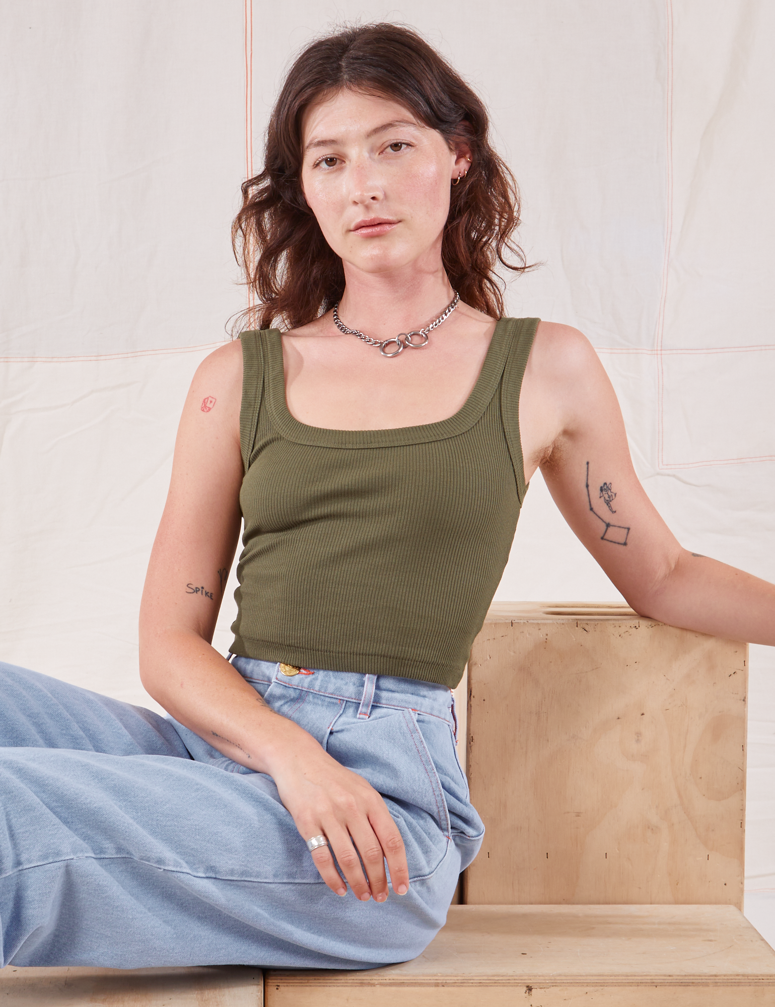 Alex is wearing Square Neck Tank in Surplus Green