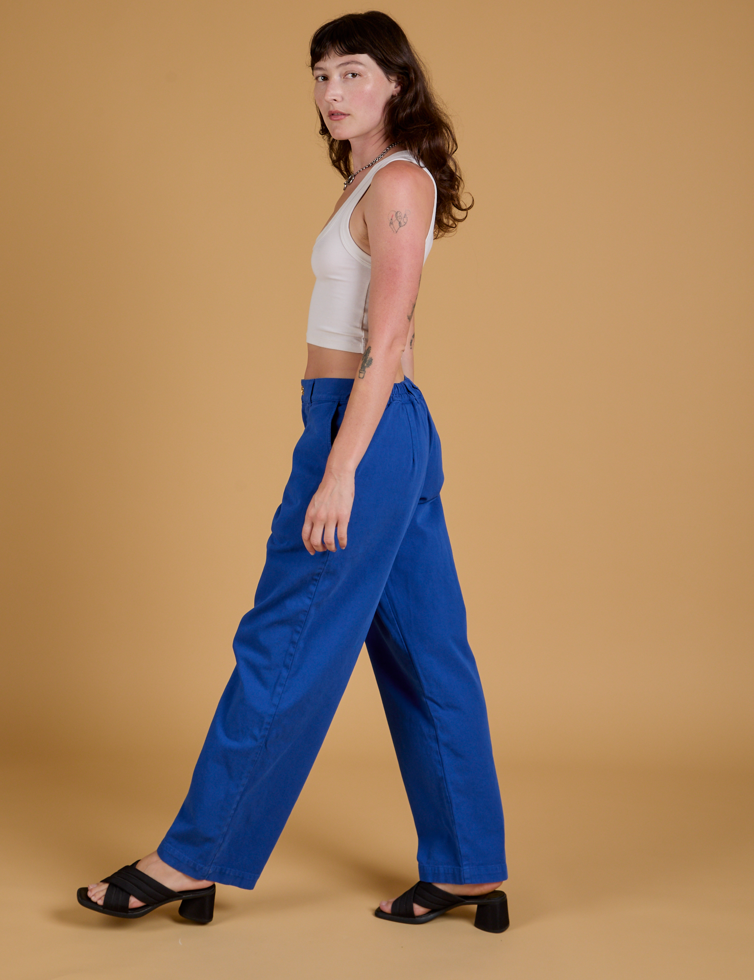 Baggy Mid-Rise Trousers in Royal Blue side view on Alex