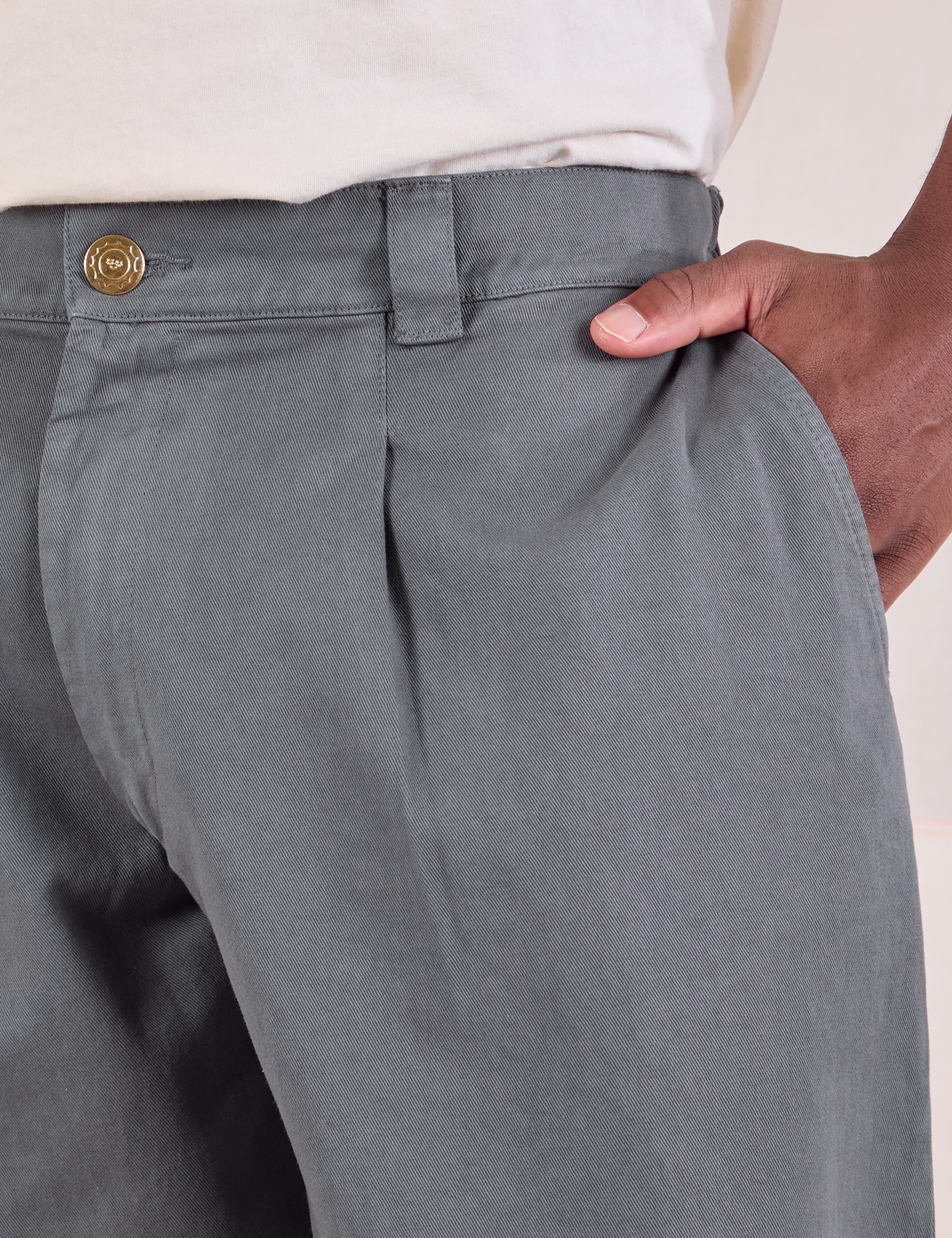 Mid-Rise Pleated Trousers in Slate Grey front close up on Issac