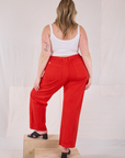 Back view of Mid-Rise Work Pants in Mustang Red and Cropped Cami in Vintage Tee Off-White on Lish