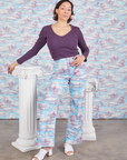 Tiara is 5'4" and wearing S Western Pants in Cloud Kingdom paired with nebula Long Sleeve V-Neck Tee