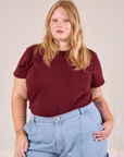 Juliet is wearing Organic Vintage Tee in Red Wine tucked into light wash Carpenter Jeans