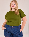 Juliet is wearing Organic Vintage Tee in Summer Olive tucked into dark wash Carpenter Jeans