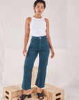 Mika is 5'1" and wearing Petite XXS Organic Work Pants in Lagoon paired with Racerback Tank in vintage tee off-white