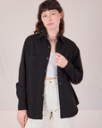 Alex is wearing Twill Overshirt in Basic Black with a Cropped Cami in vintage tee off-white underneath