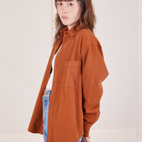 Side view of Oversize Overshirt in Burnt Terracotta worn by Hana