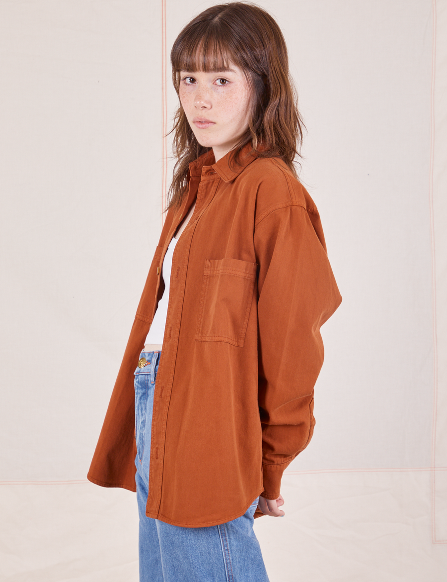 Side view of Oversize Overshirt in Burnt Terracotta worn by Hana