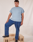 Miguel is wearing The Organic Vintage Tee in Periwinkle and dark wash Carpenter Jeans