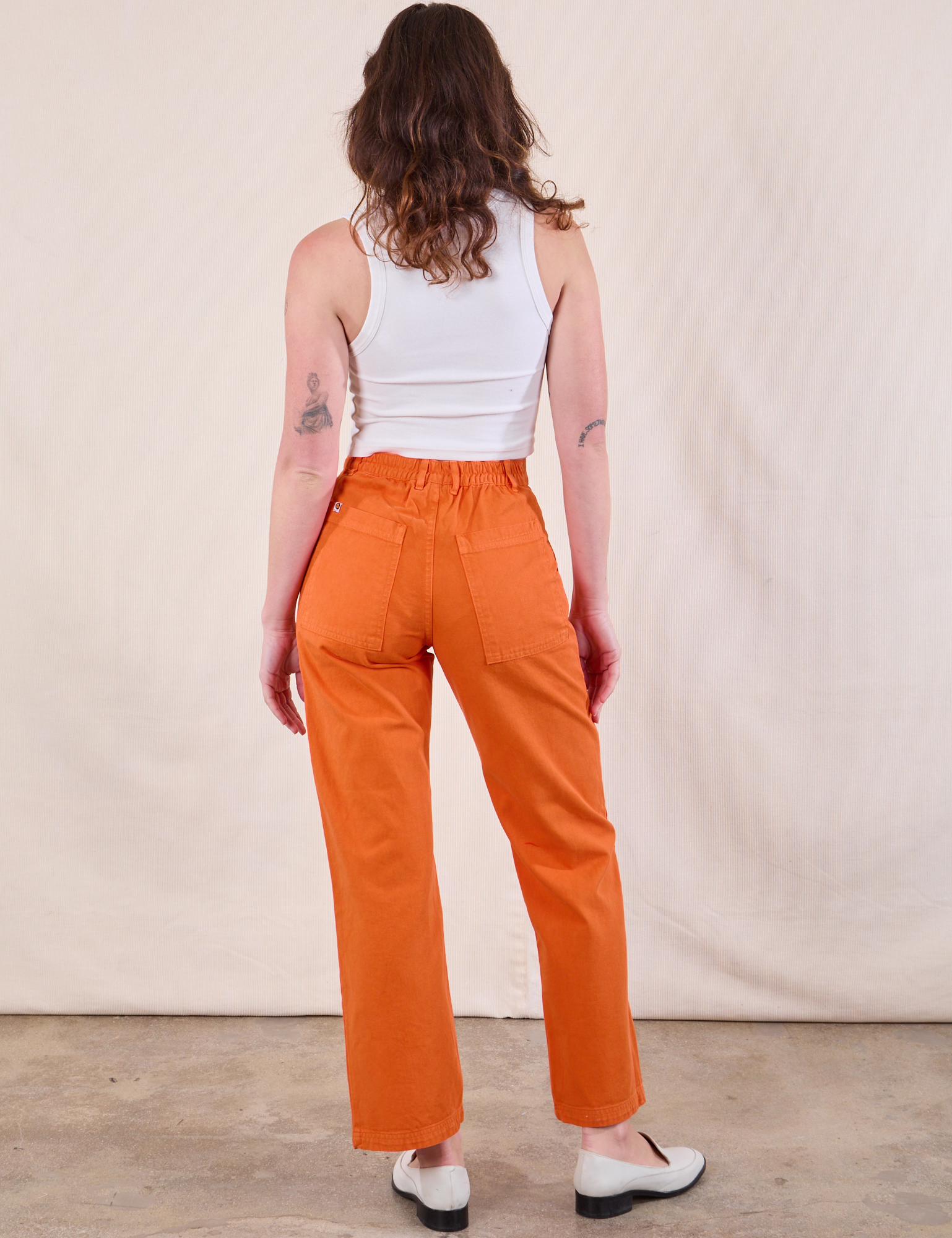 Back view of Work Pants in Construction Orange and Cropped Tank in Vintage Tee Off-White on Alex