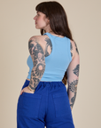 Angled back view of Racerback Tank in Baby Blue on Sydney