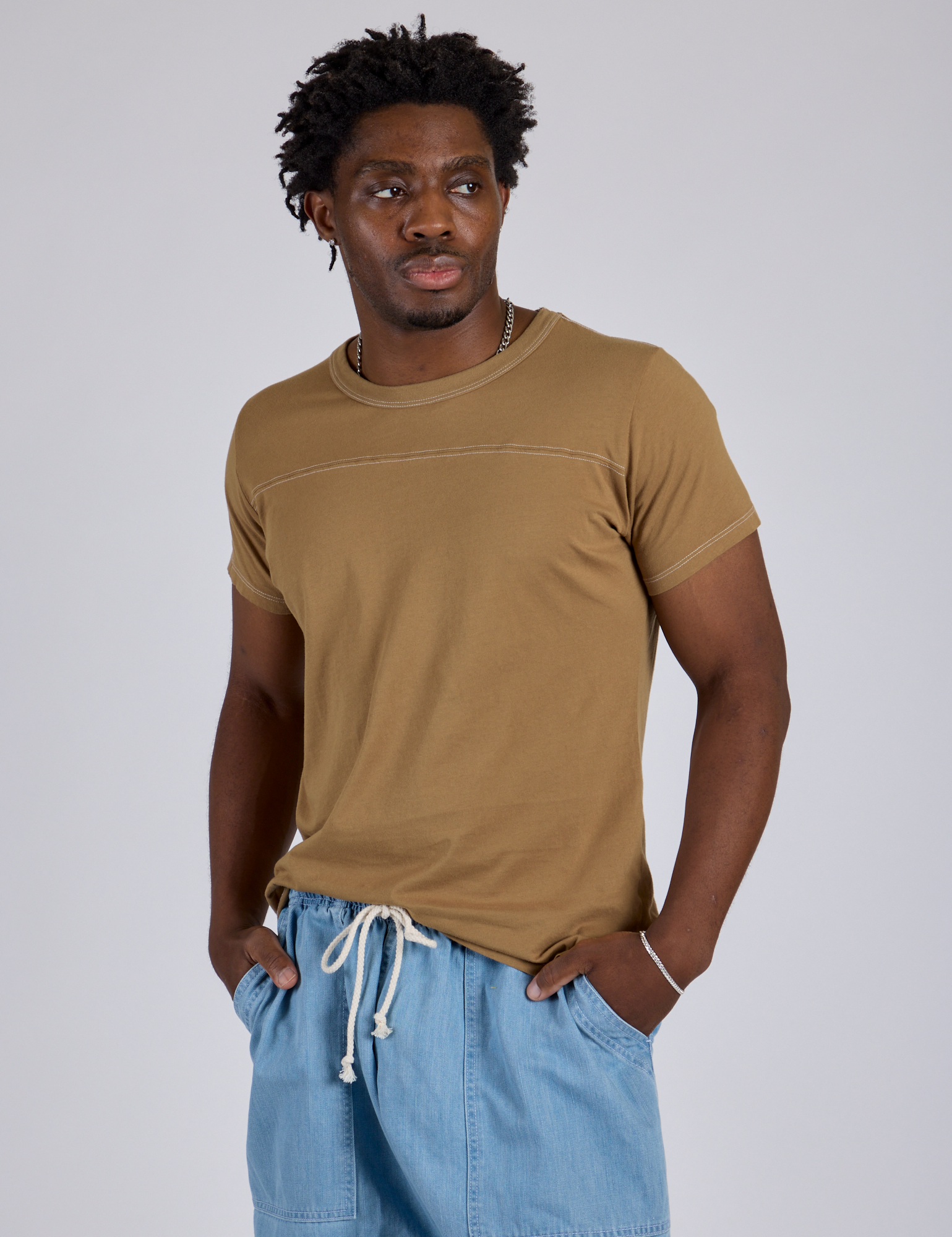 Jr. Varsity Tee in Desert Brown angled front view on Isaac