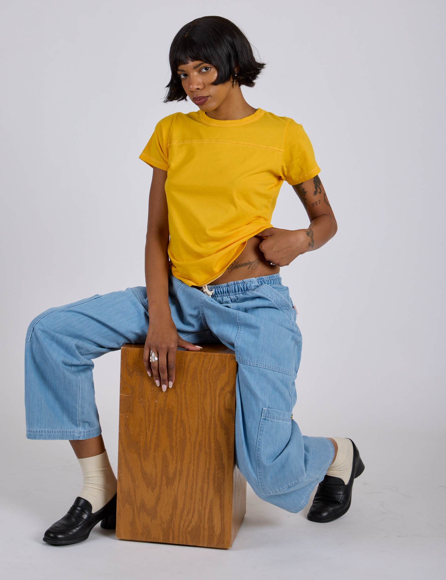 Jr. Varsity Tee in Sunshine Yellow and light wash Drop Pocket Pants on Kira