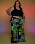 Angled front view of Tie Dyed Wide Leg Sweat Pants and black Cropped Tank on Sam