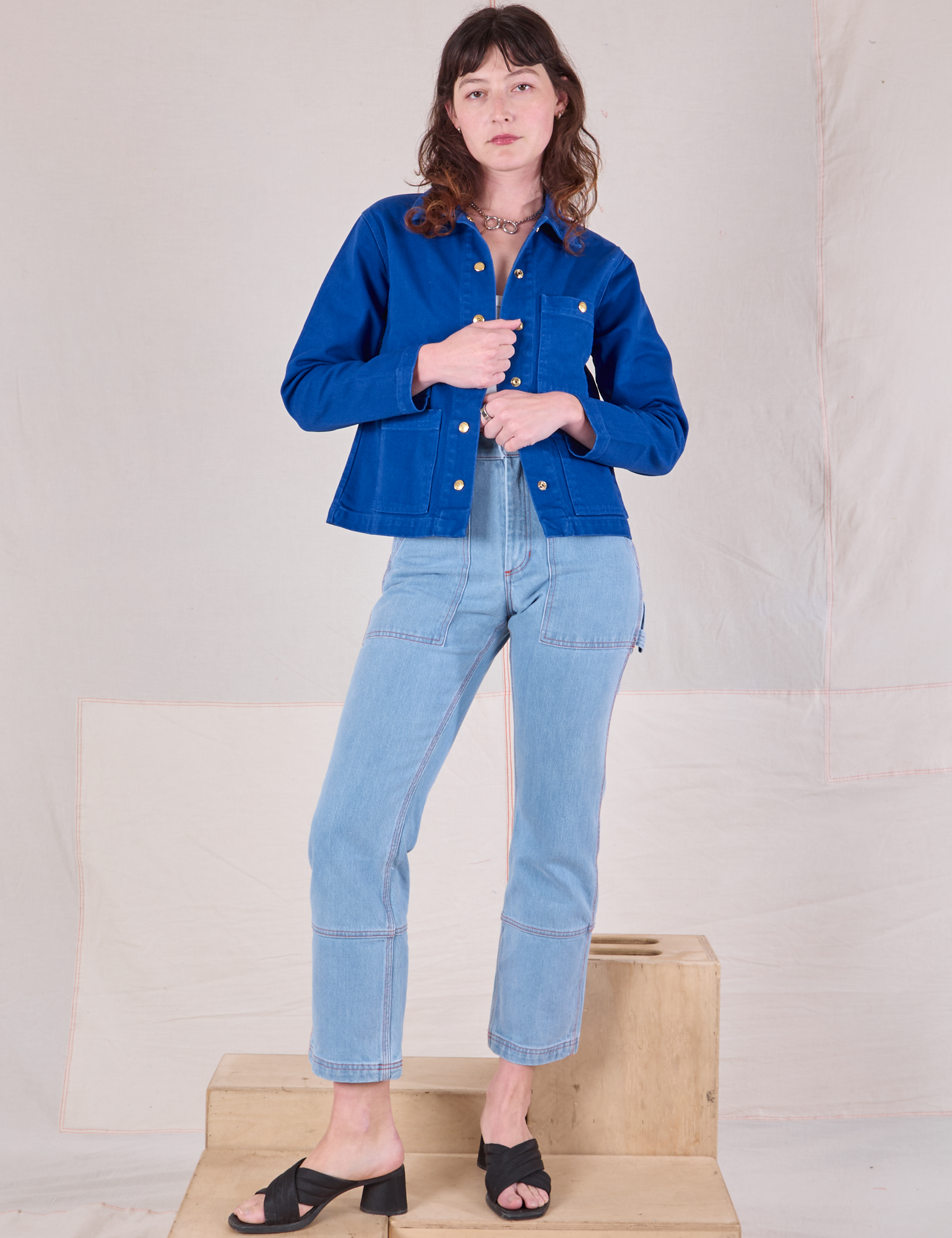 Alex is wearing Denim Work Jacket in Royal Blue paired with light wash Carpenter Jeans