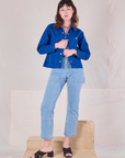 Alex is wearing Denim Work Jacket in Royal Blue paired with light wash Carpenter Jeans