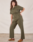 Short Sleeve Jumpsuit in Surplus Green angled front view on Ryan