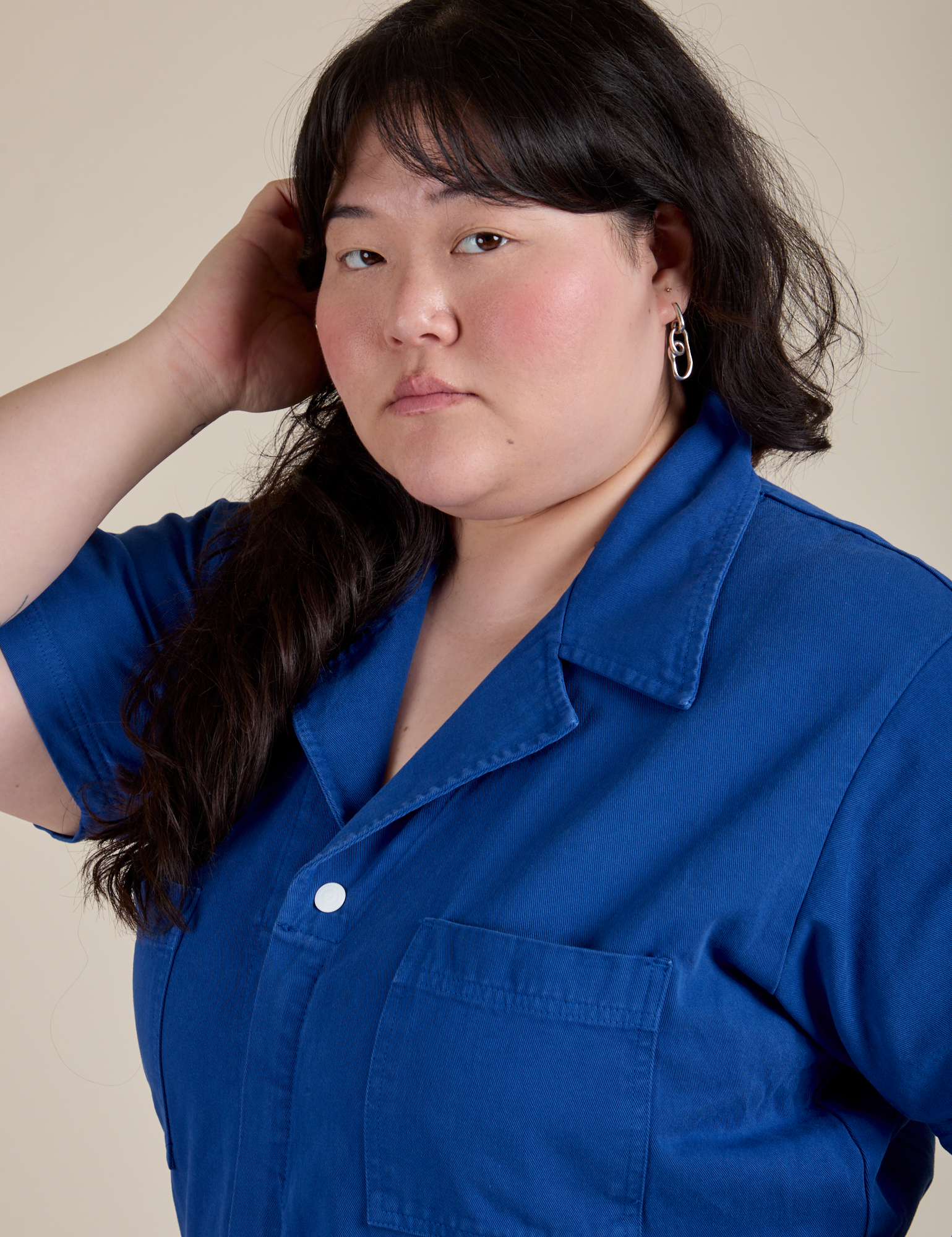 Angled front view close up of Short Sleeve Jumpsuit in Royal Blue on Ashley