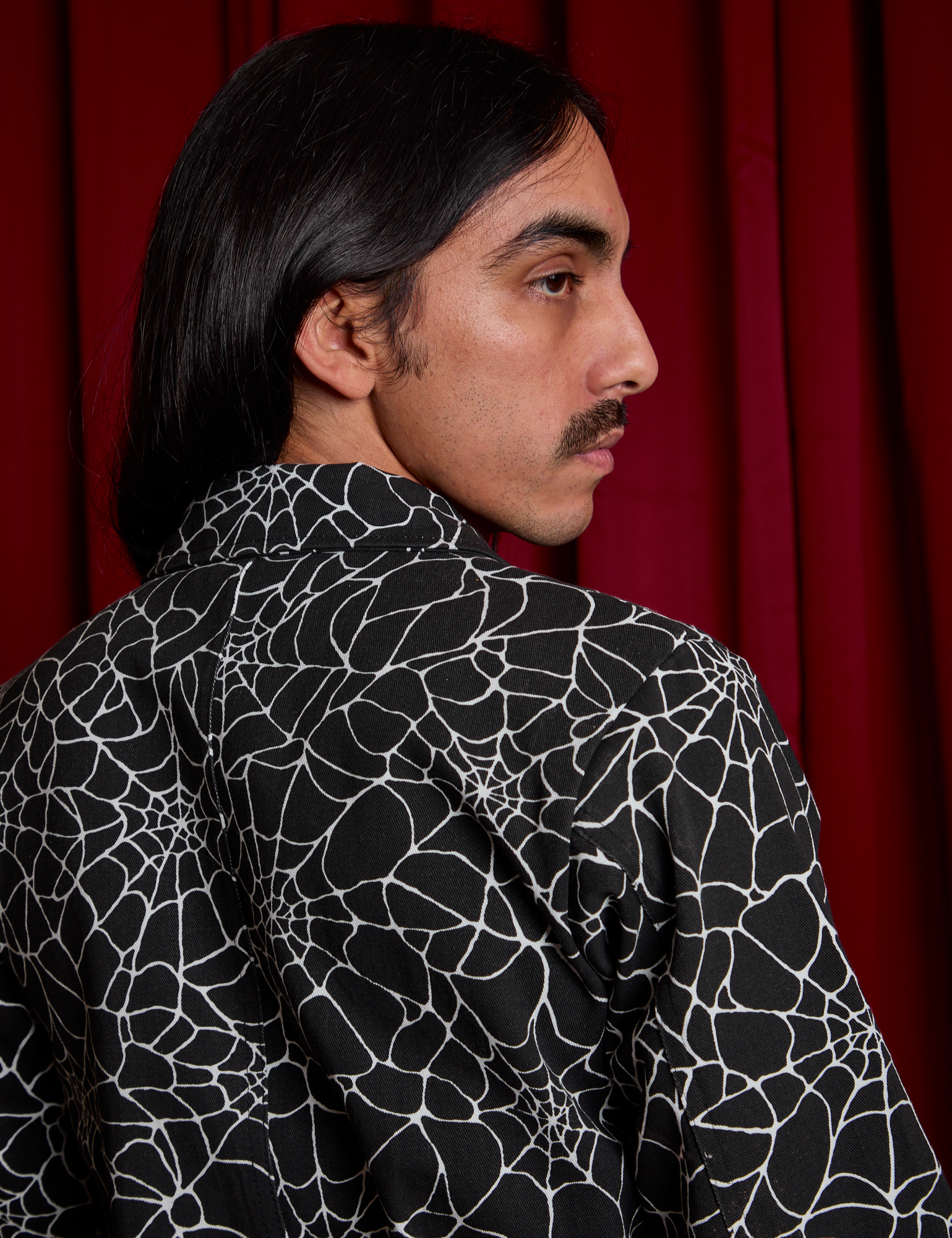 Back shoulder close up of Everyday Jumpsuit in Spiderwebs on Anthony