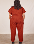 Back view of Short Sleeve Jumpsuit in Paprika worn by Alicia