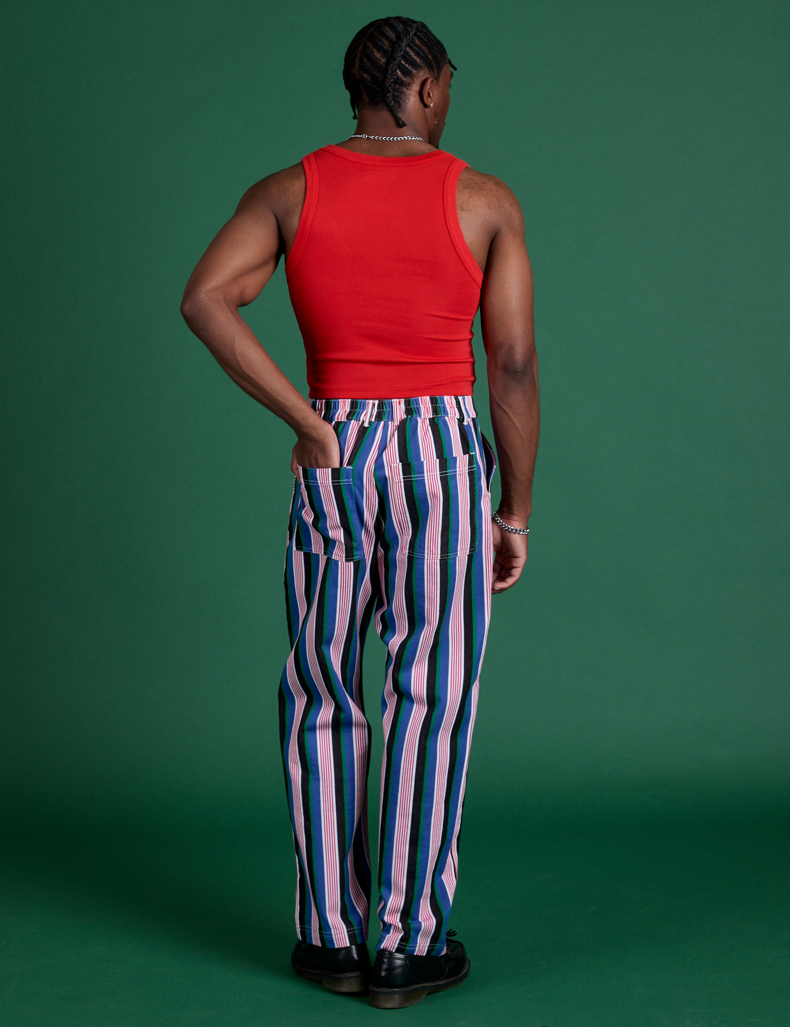 Back view of Work Pants in Pacific Stripe and mustang red Cropped Tank on Isaac