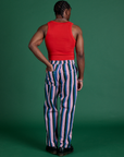 Back view of Work Pants in Pacific Stripe and mustang red Cropped Tank on Isaac