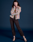 Alex is wearing Stripe Work Jacket in Rainbow Stripe paired with espresso brown Work Pants