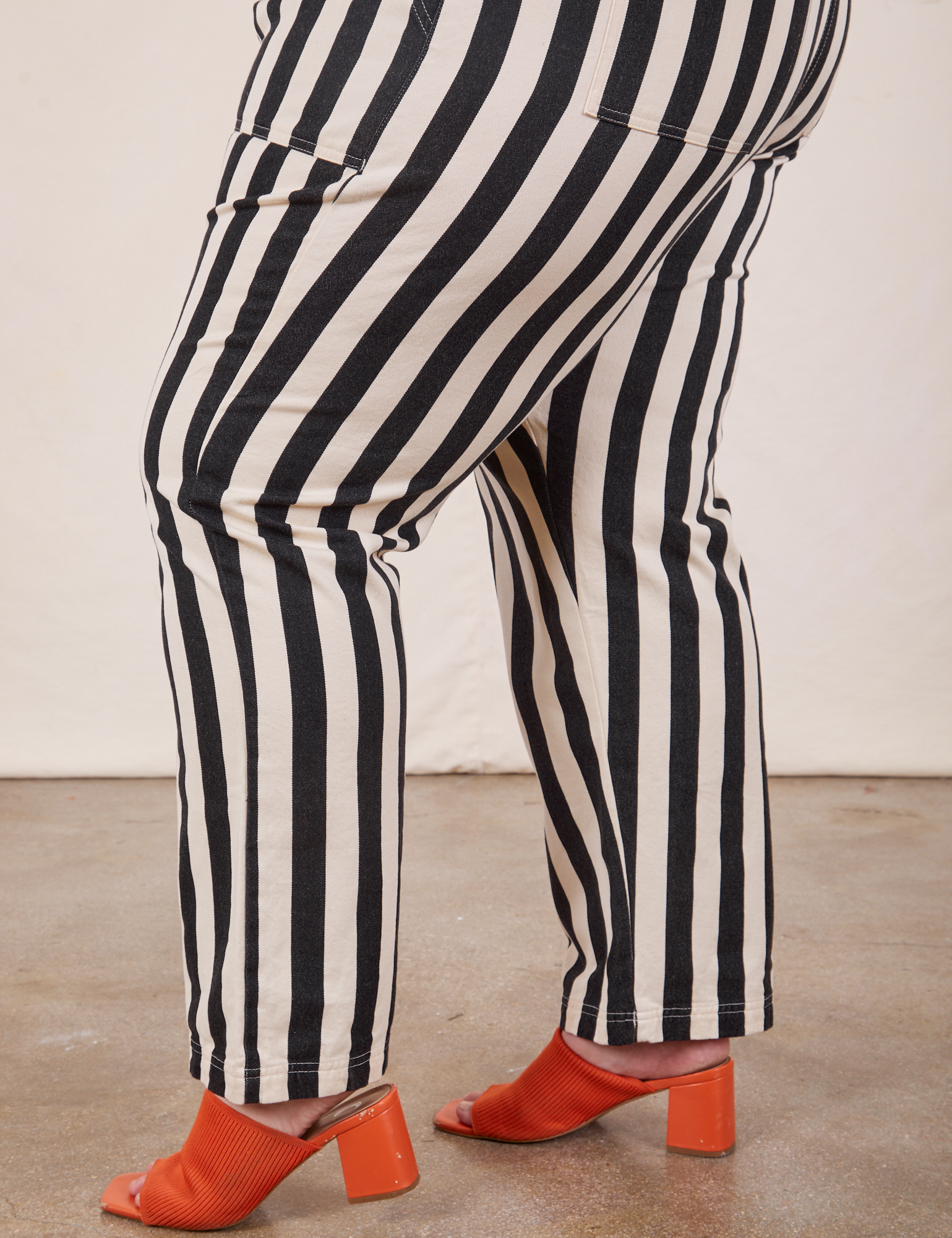Black Striped Work Pants in White pant leg side view close up on Marielena