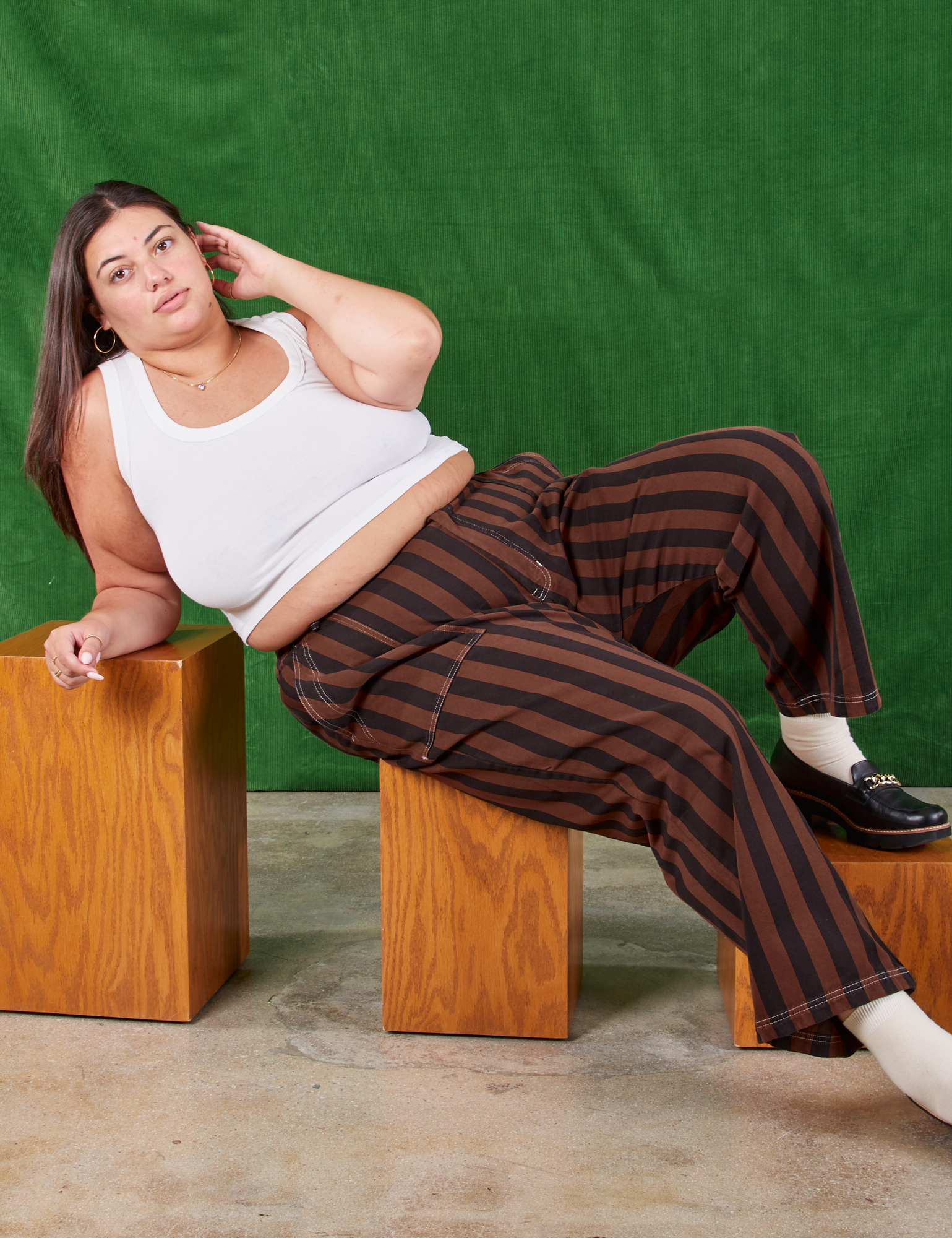 Katie is wearing Black Stripe Work Pants in Fudgesicle Brown and Cropped Tank in vintage tee off-white