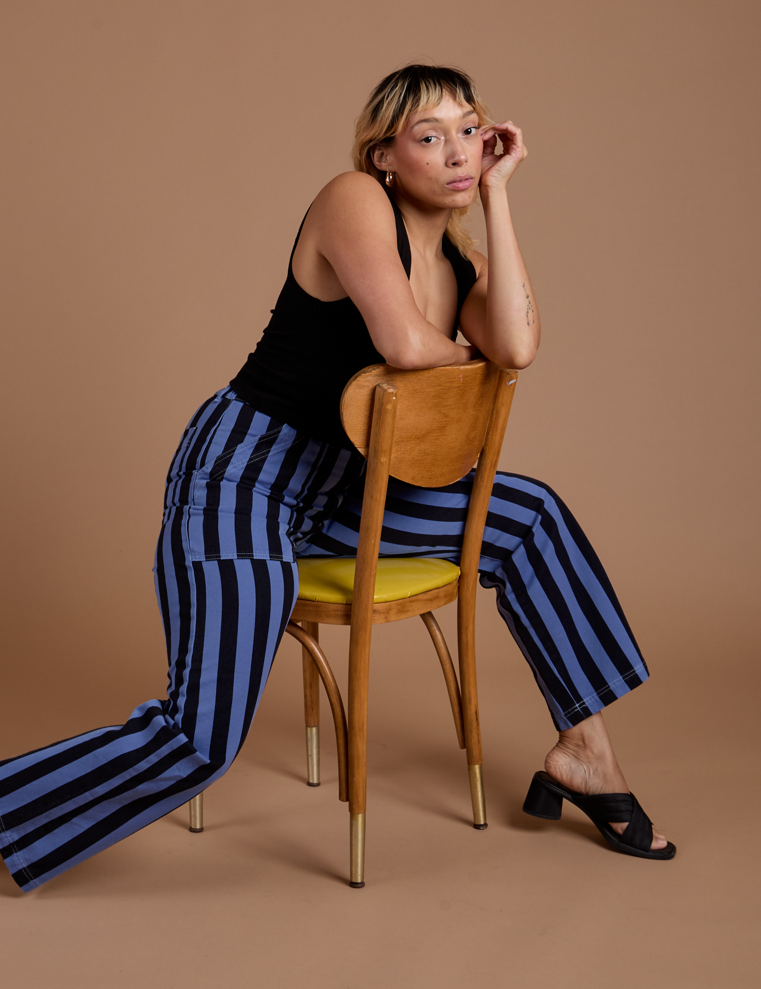 Tiara is wearing Black Stripe Work Pants in Cornflower Blue