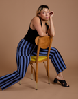 Tiara is wearing Black Stripe Work Pants in Cornflower Blue