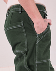 Carpenter Jeans in Swamp Green side close up on Quinn