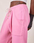 Cropped Rolled Cuff Sweatpants in Bubblegum Pink side view close up on Jerrod